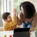 women and child high fiving