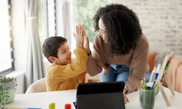women and child high fiving